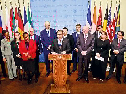 Venezuela Foreign Affairs Minister Jorge Arreaza, center, is surrounded by diplomats from several countries including Russia, China, Iran and Syria, while holding a press conference at United Nations headquarters, Thursday Feb. 14, 2019. 