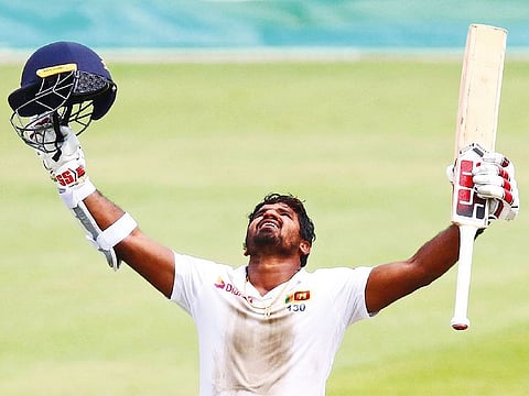 Sri Lanka’s Kusal Perera reacts after reaching his century on day four of the first Test against South Africa in Durban.