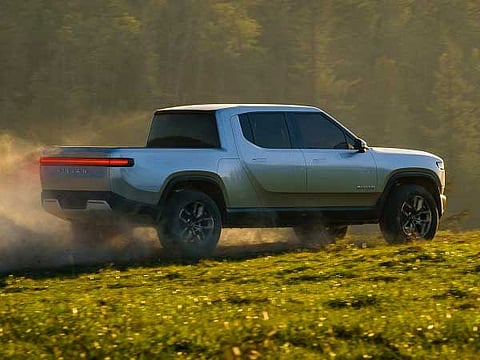 Why Amazon is investing in electric truck maker Rivian