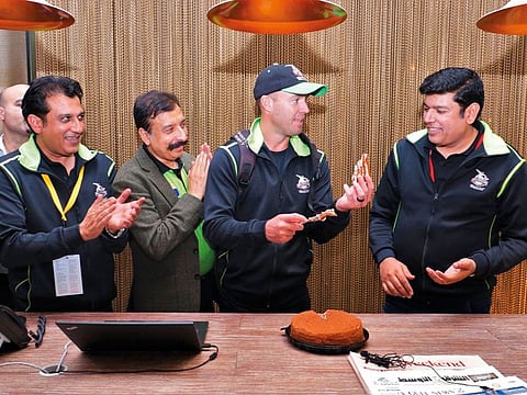 AB de Villiers cuts a cake during his birthday celebrations after his team Lahore Qalandars’ victory over Karachi Kings in a PSL match at the Dubai International Stadium on Saturday.