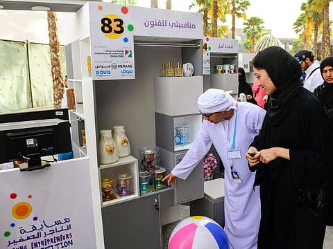 File photo: Mohammad Ahmad Al Mulla showing his traditional products to a visitor at the Young Entrepreneur Competition organised by Dubai SME, part of Department of Economic Development at City Walk. 