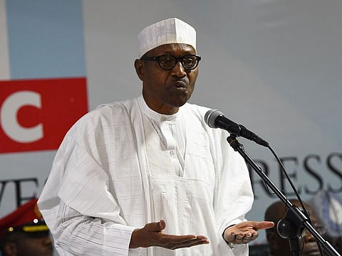 Candidate of the All Progressives Congress (APC) President Mohammadu Buhari delivers a speech during the party caucus emergency meeting on the postponed general elections in Abuja, on February 18, 2019.