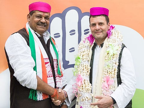 Congress President Rahul Gandhi with inducts cricketer-turned politician Kirti Azad as he joins the party in New Delhi, Monday, February 18, 2019. 