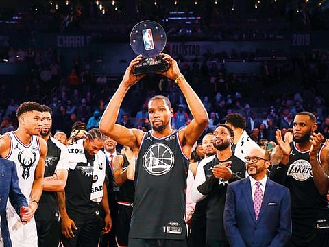 Kevin Durant #35 of the Golden State Warriors and Team LeBron celebrates with the MVP trophy after their 178-164 win over Team Giannis during the NBA All-Star game as part of the 2019 NBA All-Star Weekend at Spectrum Center on February 17, 2019 in Charlotte, North Carolina. 