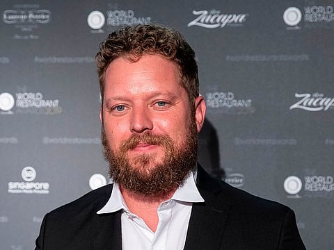 Chef Kobus van der Merwe poses after winning best restaurant during the inaugural World Restaurant Awards on February 18, 2019 at the Palais Brongniart in Paris.