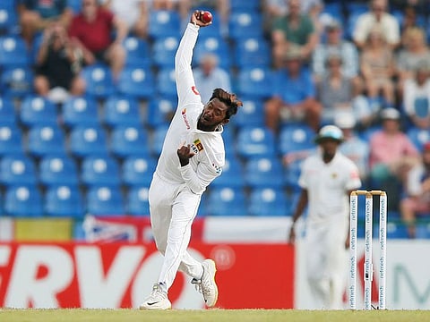 File photo: Sri Lanka's Akila Dananjaya bowls at Pallekele, Sri Lanka on November 14, 2018. 