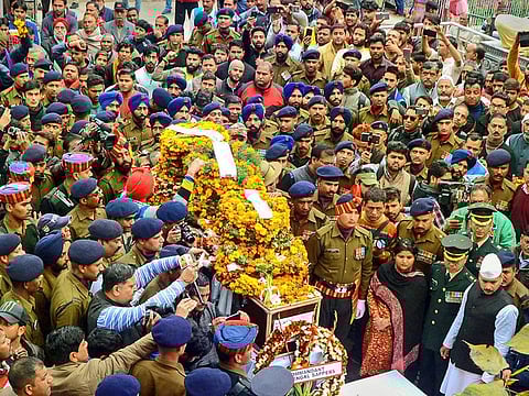 Army personnel carry the mortal remains of Maj Chitresh Singh Bisht, who was martyred while defusing an IED along the LoC in Jammu and Kashmir, during his cremation in Haridwar.