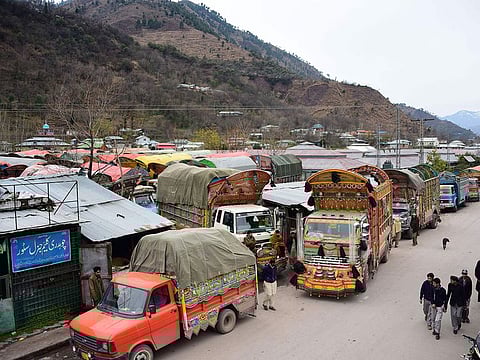 In this picture taken on February 20, 2019, goods trucks are pictured at the border town of Chakothi in Pakistan-administered Kashmir, some 3 km from Line of Control (LoC). 