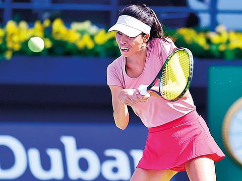 Su-Wei Hsieh powers a backhand return against Karolina Pliskova during the quarter-final match of the Dubai Duty Free Tennis Championships yesterday. The Taiwanese won 4-6, 6-1, 5-7.