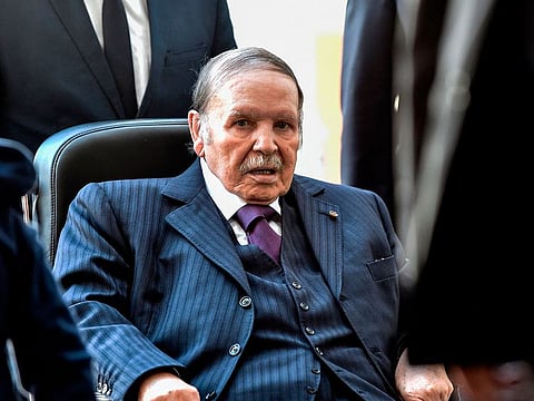 In this file photo taken on November 23, 2017, Algerian President Abdelaziz Bouteflika is seen while voting at a polling station in the capital Algiers during polls for local elections.