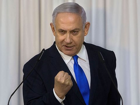 Israeli Prime Minister Benjamin Netanyahu gestures as he delivers a statement 