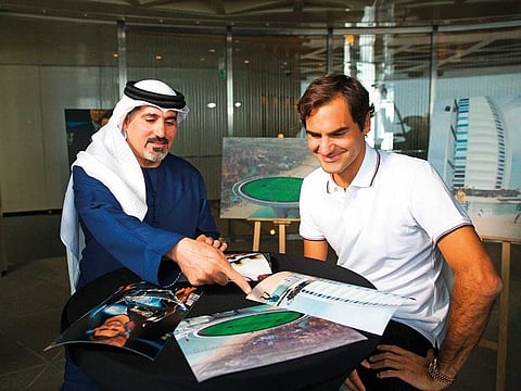 Tournament Director Salah Tahlak with Roger Federer at The Lounge, Burj Khalifa, Dubai