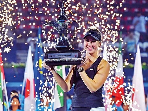 Belinda Bencic with the trophy after winning the Dubai Duty Free Tennis Championship at the Dubai Tennis Stadium on Saturday.