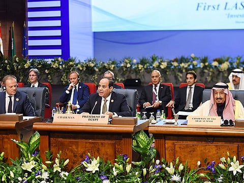 President of the European Council Donald Tusk (L) along with King Salman of Saudi Arabia (R) listen to Egyptian President Abdul Fattah Al Sisi (C) as he speaks during the opening of the first joint European Union and Arab League summit in the Egyptian Red Sea resort of Sharm Al Shaikh, on February 24, 2019. 