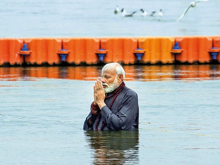 Prime Minister Narendra Modi takes a holy dip at Sangam
