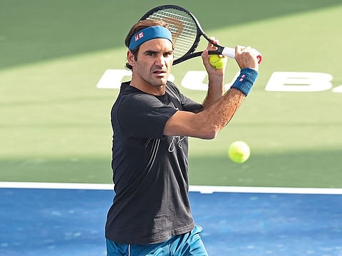 Roger Federer is seen practicing at the centre court in Dubai on Sunday. 