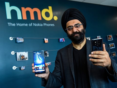 Sanmeet Singh Kochhar, general manager for the Middle East at HMD Globa, holds Nokia 9 PureView. 