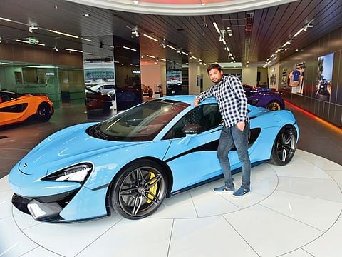 Balvir Singh with the McLaren 570S Spider. He plans to buy a “nice car” back home in India.