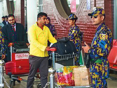 Bangladeshi security personnel stand guard at the Hazrat Shahjalal International Airport in Dhaka on February 25, 2019.