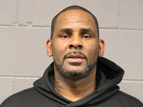 R&B singer R. Kelly is photographed during booking at a police station in Chicago.