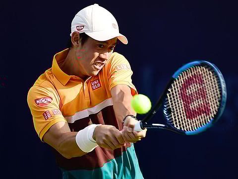 Kei Nishikori of Japan in action against Benoit Paire of France during the Dubai Duty Free Tennis Championships on Tuesday. 