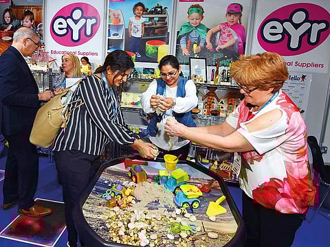 Visitors tring the Kinetic sand from Early Year Resources during the 12th Global Education Forum and the Global Education Supplies and Solution Exhibition 2019 at Dubai World Trade Center.