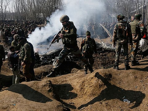 Indian army soldiers arrive near the wreckage of an Indian aircraft after it crashed in Budgam area