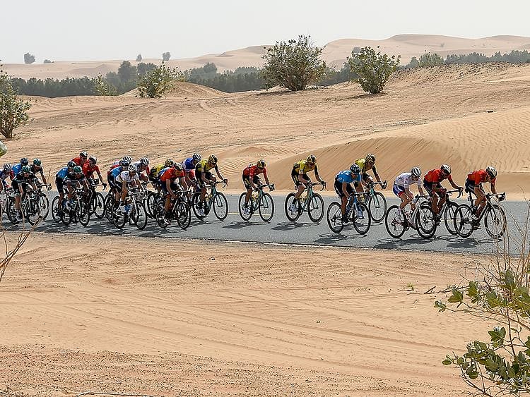 Cyclists pass Nazwa area in Sharjah