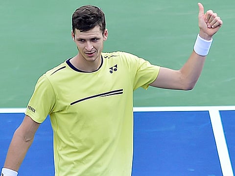 Hubert Hurkacz celebrates his victory against Kei Nishikori at the Dubai Duty Free Tennis Championships on Wednesday. 