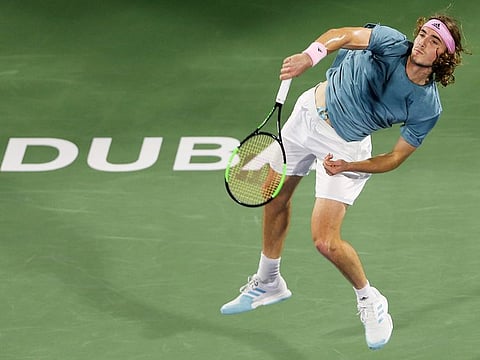 Stefanos Tsitsipas of Greece serves to Matthew Ebden of Australia during their match at the Dubai Duty Free Tennis Championship, on Tuesday, February 26, 2019.