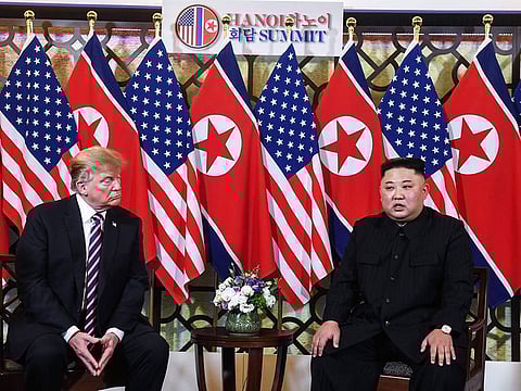US President Donald Trump (L) listens to North Korea's leader Kim Jong Un during a meeting at the Sofitel Legend Metropole hotel in Hanoi on February 27, 2019