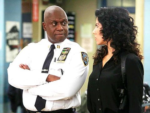 Andre Braugher, left, and Stephanie Beatriz appear in a scene from the comedy "Brooklyn Nine Nine."