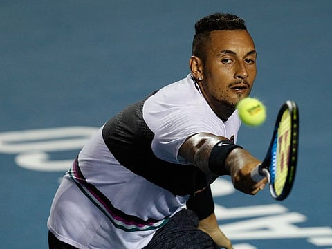Australia's Nick Kyrgios rolls plays ball in his Mexican Tennis Open round 2 match against Spain's Rafael Nadal, in Acapulco, Mexico, Wednesday, Feb. 27, 2019.