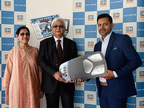 Haresh Ahuja and Rashmi Ahuja winners of the Audi car receive the key from Shamim Valappil, District Manager of Gulf News