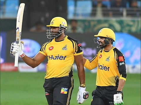 Peshawar Zalmi’s Kieron Pollard celebrates his half century against Multan Sultans at the Dubai Cricket Stadium.