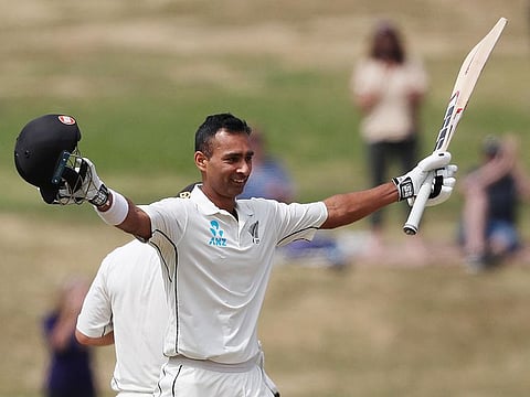 New Zealand's Jeet Raval celebrates his century during day two of the first cricket Test match between New Zealand and Bangladesh at Seddon Park in Hamilton on March 1, 2019. 