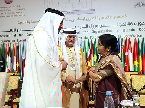 Shaikh Abdulla BIn Zayed Al Nahyan, UAE Minister of Foreign Affairs, and Anwar Gargash, Minister of State for Foreign Affairs, are seen with Sushma Swaraj, External Affairs Minister of India during the OIC meeting in Abu Dhabi.