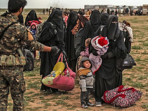 Civilians evacuated from Daesh’s embattled holdout of Baghouz wait at a screening area held by the Syrian Democratic Forces in the eastern Syrian province of Deir Al Zor.