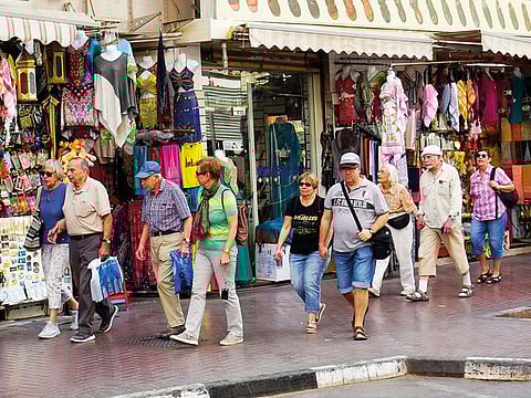 Tourists at a Deira market, in Dubai.