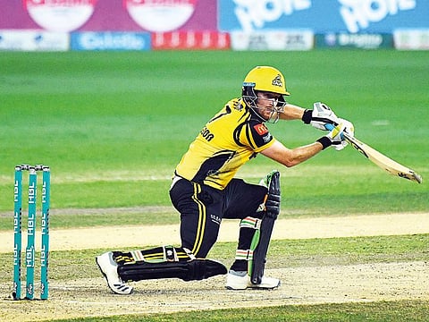 Peshawar Zalmi’s Liam Dawson drives the ball against Islamabad United at the Dubai Cricket Stadium.