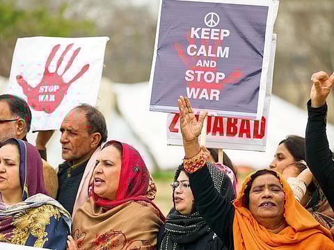 Residents of Pakistan-administered Kashmir march, in Islamabad, during a rally held to protest against India.