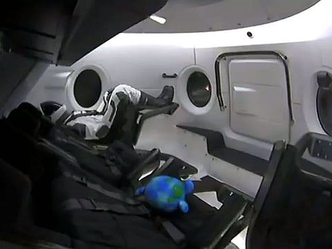 This video grab taken from the Space X webcast transmission on March 2, 2019, shows a dummy named Ripley onboard a SpaceX Falcon 9 rocket with the company's Crew Dragon spacecraft onboard lifting off during the Demo-1 mission, at the Kennedy Space Center in Florida on March 2, 2019. 