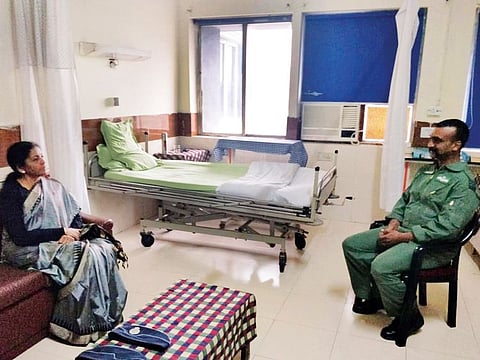 Defence Minister Nirmala Sitharaman with Abhinandan Varthaman at his hospital room in New Delhi on Saturday.
