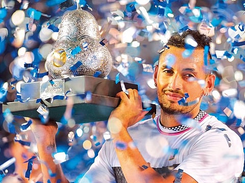 Australian tennis player Nick Kyrgios holds the trophy after defeating German tennis player Alexander Zverev during the Mexico ATP Open men's singles tennis final in Acapulco, Guerrero state on March 2, 2019. 
