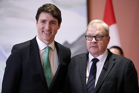 Canada's Prime Minister Justin Trudeau poses with Lawrence MacAulay after he was sworn-in as Minister of Veterans Affairs and Associate Minister of National Defence during a cabinet shuffle at Rideau Hall in Ottawa, Ontario, Canada, March 1, 2019.