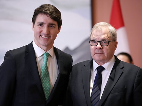 Canada's Prime Minister Justin Trudeau poses with Lawrence MacAulay after he was sworn-in as Minister of Veterans Affairs and Associate Minister of National Defence during a cabinet shuffle at Rideau Hall in Ottawa, Ontario, Canada, March 1, 2019.