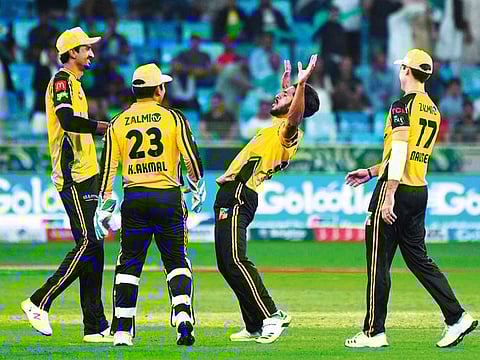 Peshawar Zalmi players celebrate after a win over Lahore Qalandars during 2019 edition of PSL in the UAE.