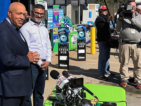 this Wednesday, Oct. 24, 2018 file photo, South Carolina Education Lottery Chief Operating Officer Tony Cooper, left, and KC Mart owner CJ Patel, right, speaks to reporters about the winning ticket sold at the Simpsonville, S.C., store.