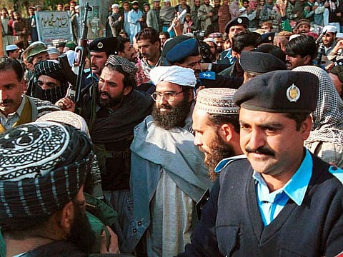 Masood Azhar, center, (wearing glasses and white turban), leader of Jaish-e-Mohammad seen arriving in Islamabad, Pakistan in this January 27, 2000 file photo.  