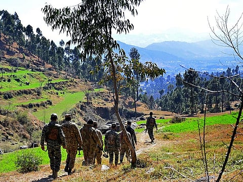 Pakistani soldiers patrol in the area where Indian planes were reportedly shot down by Pakistani forces, after India launched airstrikes on February 26th, in Jaba, near Balakot.